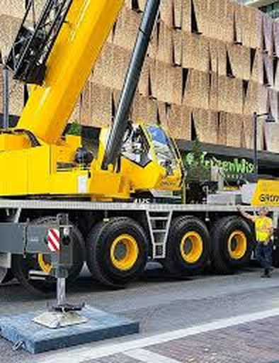 Mobile crane set up on a city street